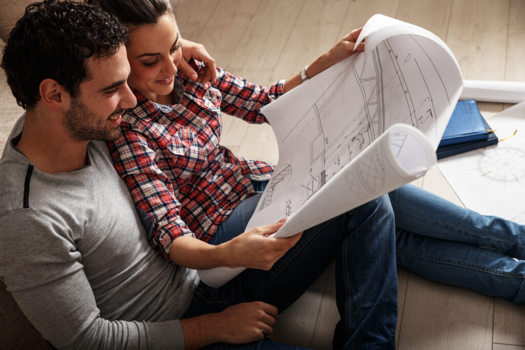 Young couple looking a building a home