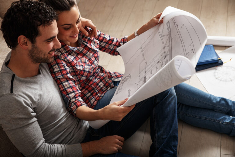 Young couple looking a building a home